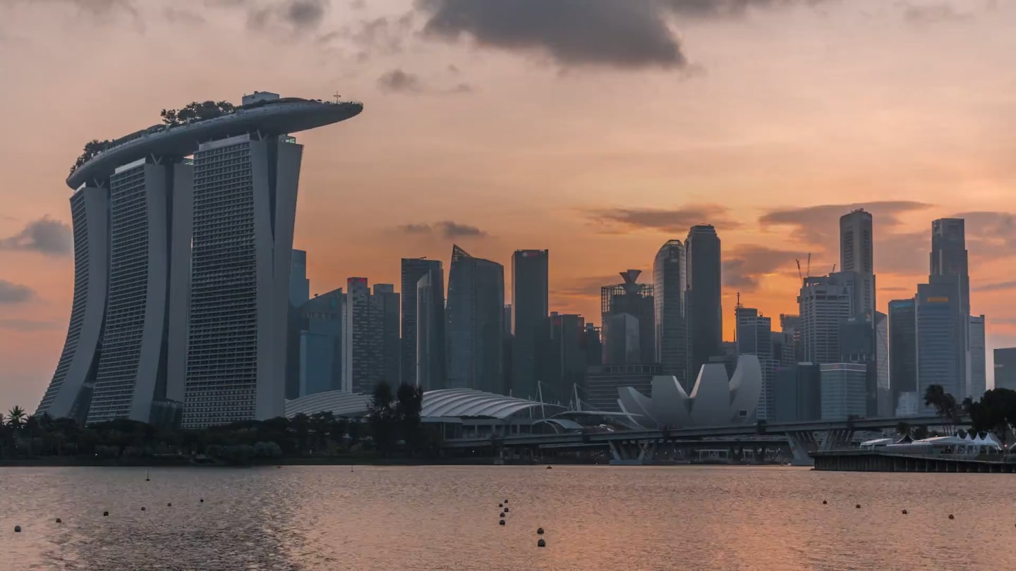 Photograph of the Singapore City skyline at sunset and video of the Skincare Science Summit in Singapore 2023.